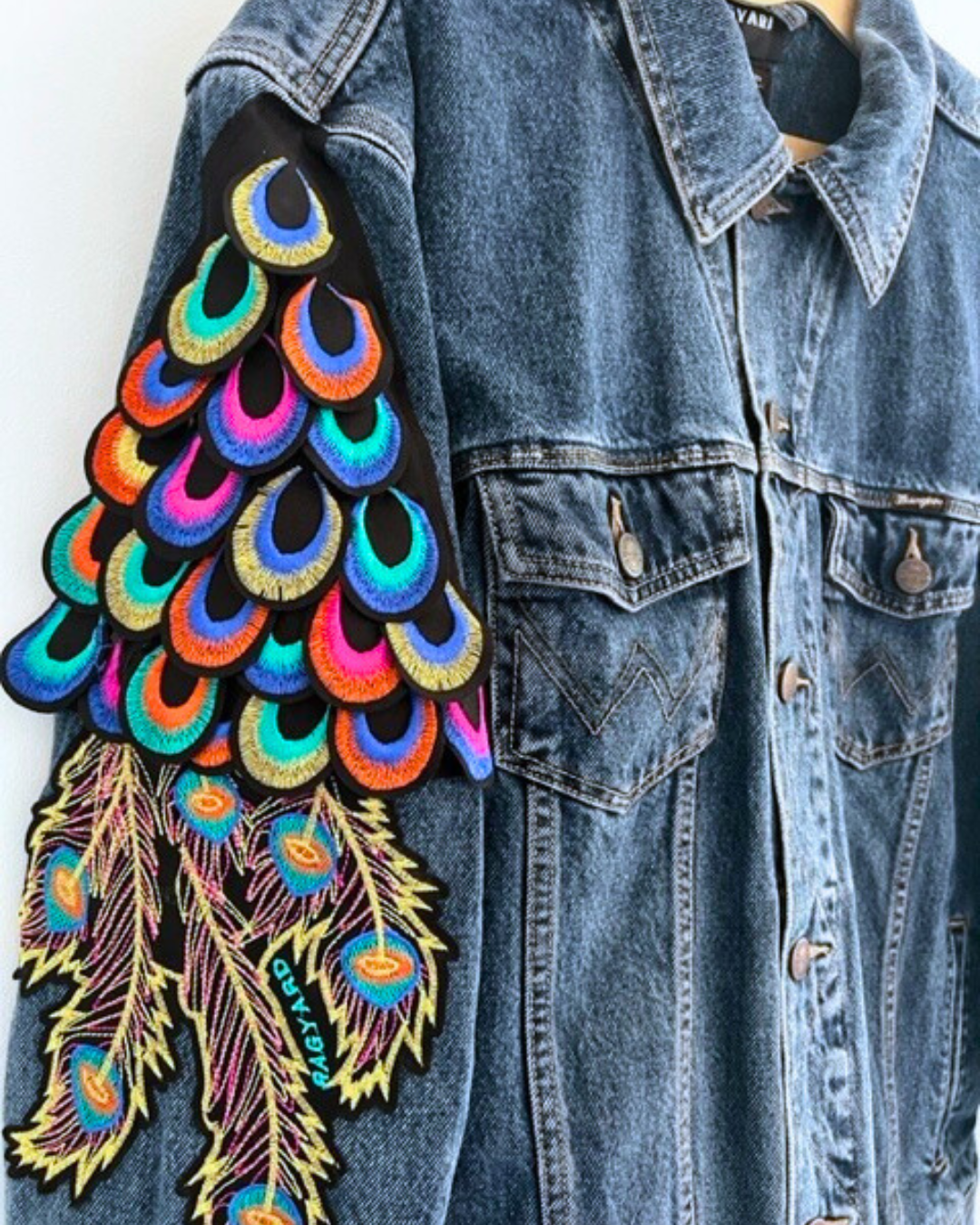 Vintage WRANGLER dark blue denim jacket with psychedelic peacock sleeve embellishment