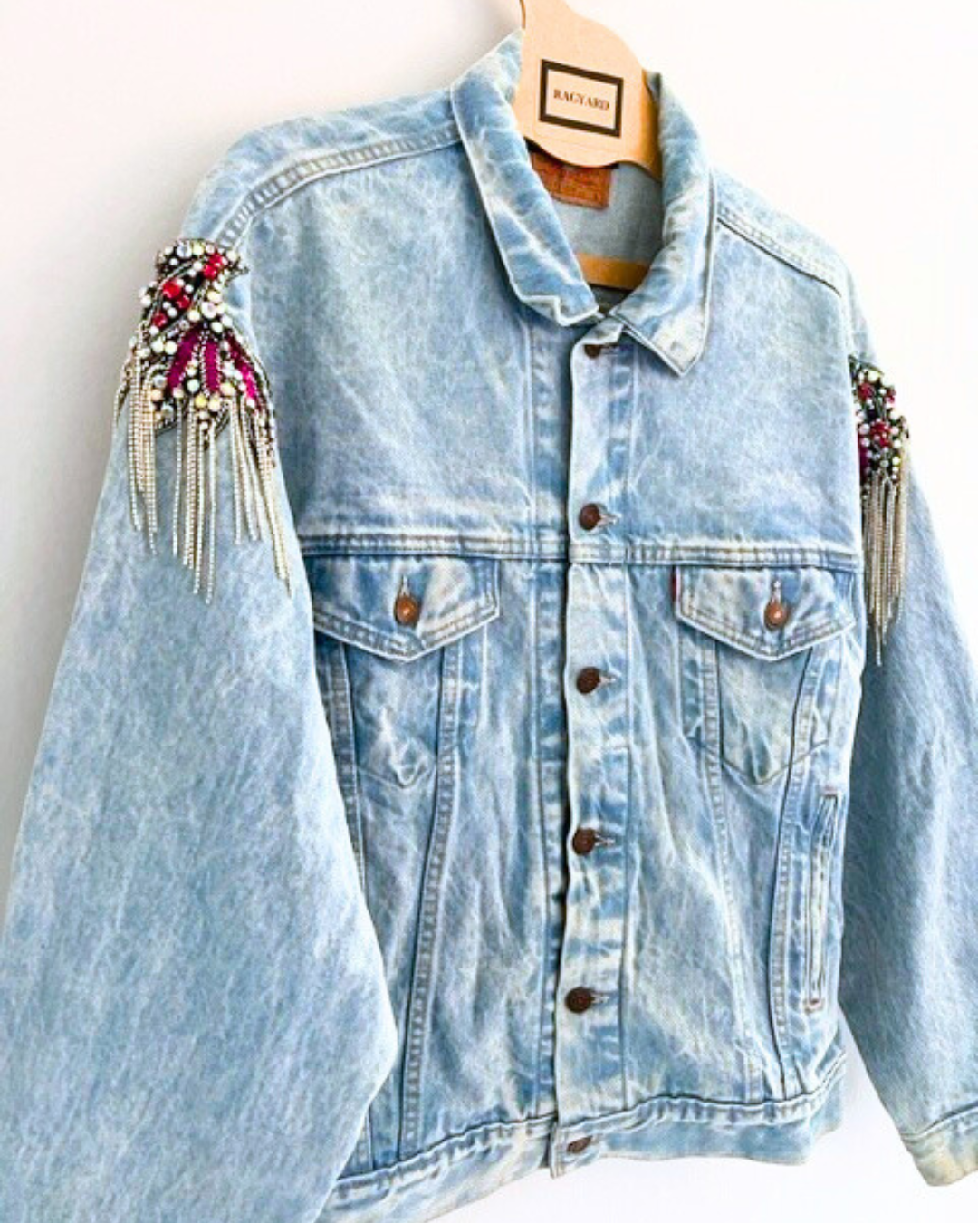 Vintage LEVI bleached denim jacket with crystal and chain shoulder embellishment