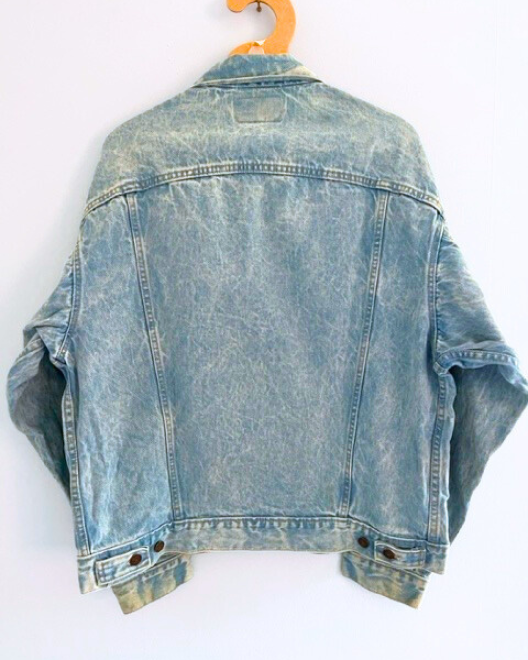 Vintage LEVI bleached denim jacket with crystal and chain shoulder embellishment